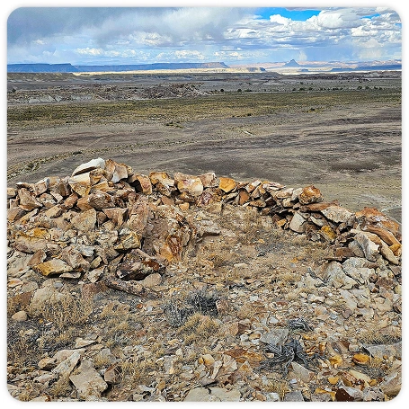 Photograph of ancient stone dwelling ruins.