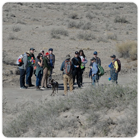 Photograph of students gathering in a field.